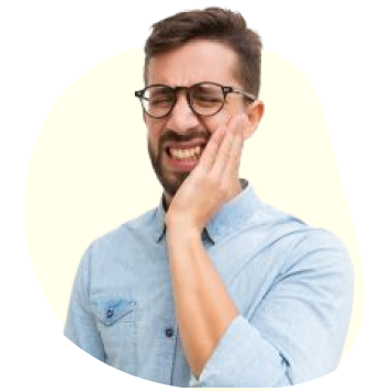 Guy wearing eyeglasses has toothache and holding his face